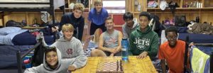 group inside cabin with chess board